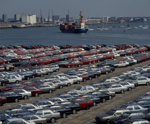 INDUSTRY, Cars, Southampton Docks. Rows of imported cars with container ships and boats on the