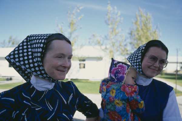 CANADA, Alberta, Hutterite women and child from the Milford farming colony near Raymond.
