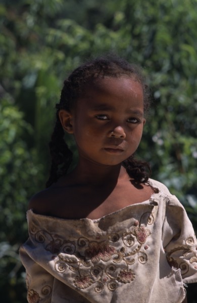 MADAGASCAR, People, Children, Road to Ambalavao. Portrait of a young girl wearing pig tails in her