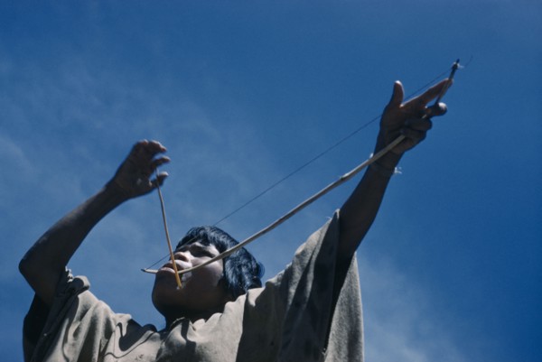 COLOMBIA, Sierra de Perija, Yuko - Motilon , Portrait of woman playing musical bow.  The