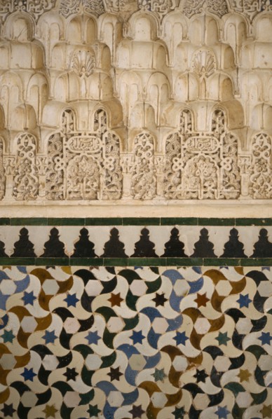 SPAIN, Andalucia, Granada, The Alhambra.  Detail of stucco and tiles