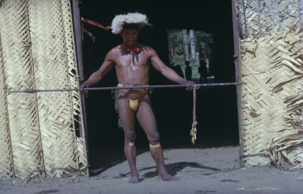 COLOMBIA, Vaupes Region, Tukano Tribe, "Shaman in full festive regalia – feather head-dress, red