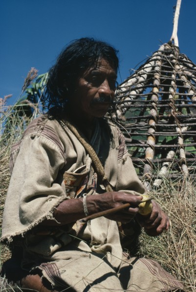 COLOMBIA, Sierra Nevada de Santa Marta, San Antonio, "Mama/Priest Valencia takes a ""coca break"" -