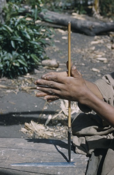 COLOMBIA, Sierra de Perija, Yuko - Motilon ., Man drills hole in base of steel arrow-head for