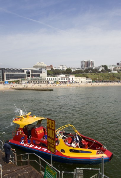 ENGLAND, Dorset, Bournemouth, Speed Boat ride from the Pier with The East Beach and the Imax
