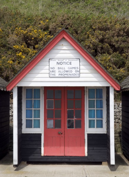 ENGLAND, Dorset, Bournemouth, Beach hut on The East Beach with a sign saying that no ball games are