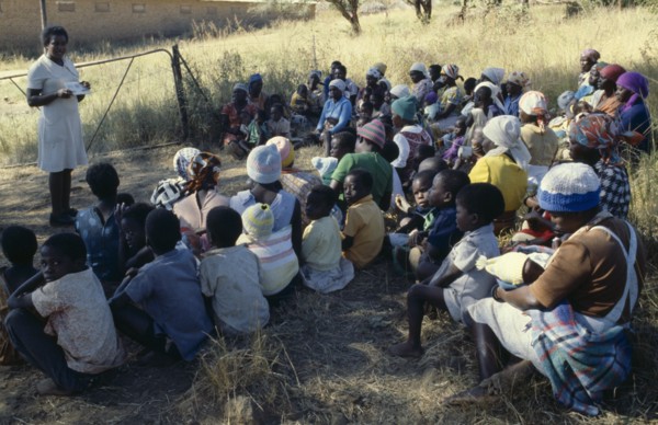 ZIMBABWE, People, Family Planning Association education officer and distributor talking to women on