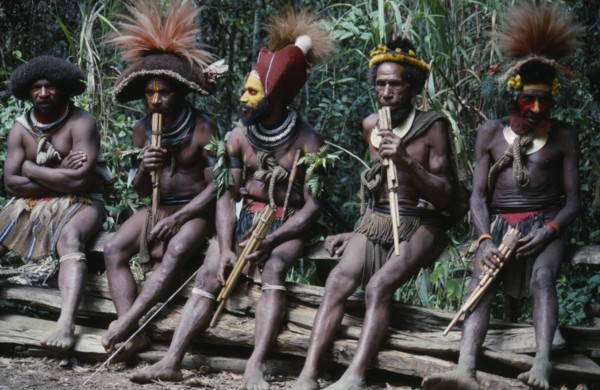 PACIFIC ISLANDS, Melanesia, Papua New Guinea, Southern Highlands. Huli tribe men sat together
