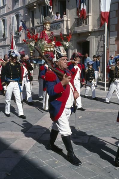 FRANCE, Provence Cote D Azur, Var, Saint Tropez. Bravade Festival with men in costume marching in a