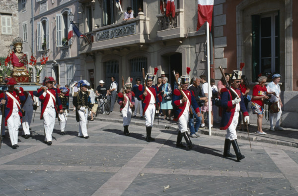 FRANCE, Provence Cote D Azur, Var, Saint Tropez. Bravade Festival with men in costume marching in a