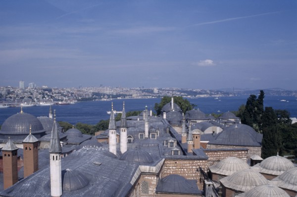 TURKEY, Istanbul, Topkapi Palace.  View across rooftops of the Harem to the Bosphorous.