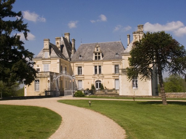 FRANCE, Deux Sevres Region, Poitiers, Gravelled path leading up to the iron entrance gate of the