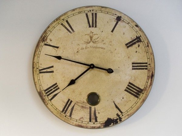 FRANCE, Deux Sevres Region, Poitiers, A classic clock face with Roman numerals against a plain