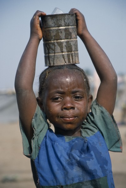 GUINEA, Kissidougou Camp, Little girl with braided hair at camp for refugees from Sierra Leone