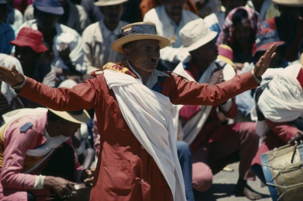 MADAGASCAR, Antananarivo, Traditional dancers and folk musicians playing to crowds.