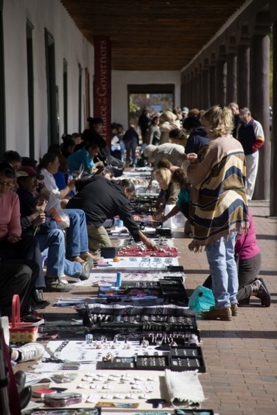 USA, New Mexico, Santa Fe, Native American Pueblo Indian market stalls under the arches of the