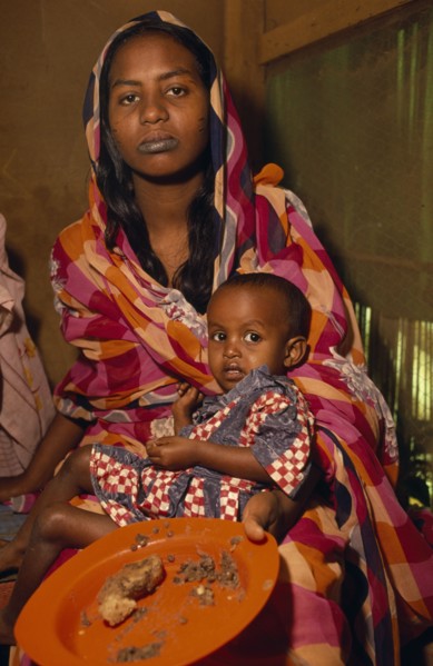 SUDAN, Khartoum, Woman and child displaced by war.