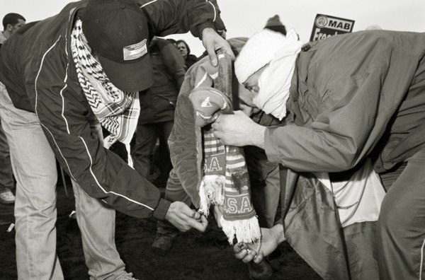 ENGLAND, London, Hyde Park, Islamic protesters burn North American paraphanalia during the One