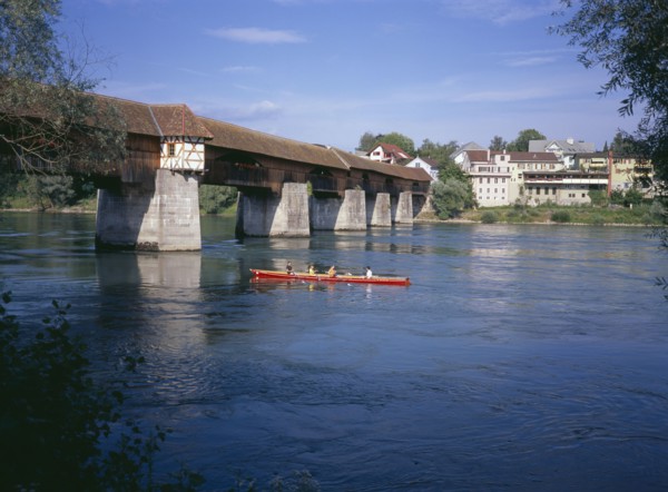 GERMANY, Baden Wurttemberg, Covered wooden bridge over the Rhine which links Badsackingen with the