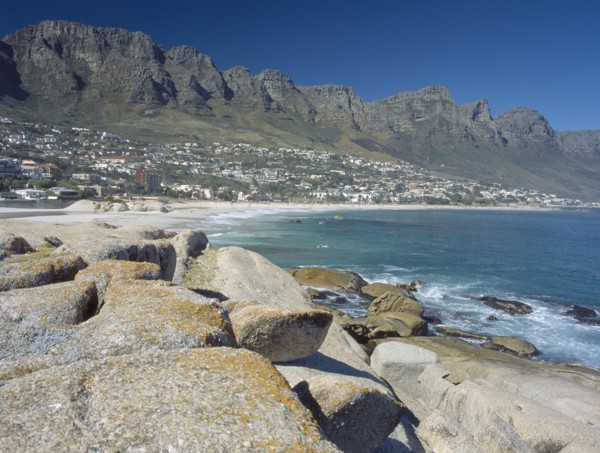 SOUTH AFRICA, Western Cape, Cape Penninsula, View across rocks towards Clifton bay and beach.