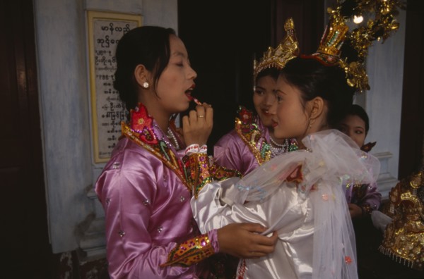 MYANMAR, Mandalay, Funeral dancers putting on make up at the funeral for an Abbot at the Endawya