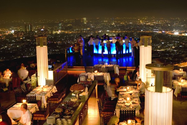 THAILAND, Bangkok, Sorocco Restaurant. View over people dining at tables lit up with light displays