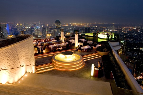 THAILAND, Bangkok, Sorocco Restaurant. View down steps towards people dining at tables lit up with