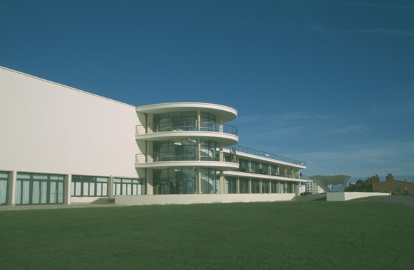 ENGLAND, East Sussex, Bexhill on Sea, De La Warr Pavilion. Exterior view over grass towards back