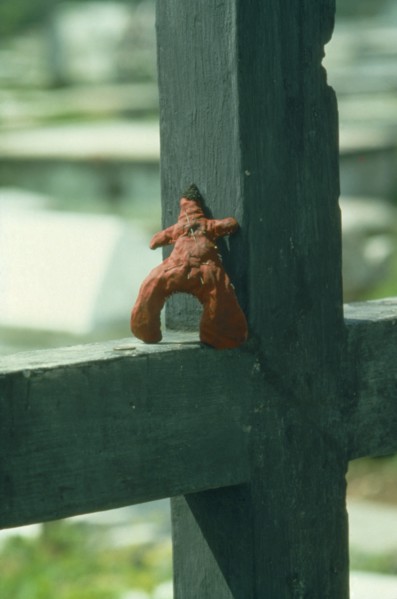 HAITI, Voodoo, Pins stuck in the heart of a voodoo doll in graveyard.