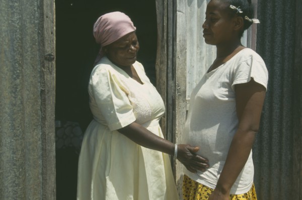 MAURITIUS, Rodrigues Island, Seventy year old traditional birth attendant with thirty five year old