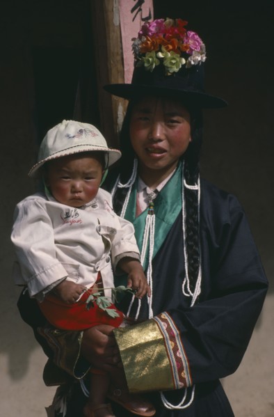 CHINA, Qinghai Province, Huzhu District, Tu minority Tibetan Buddhist mother and daughter.