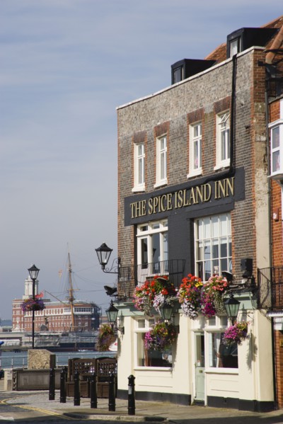 ENGLAND, Hampshire, Portsmouth, The Spice Island Inn at Old Portsmouth with HMS Warrioir and the