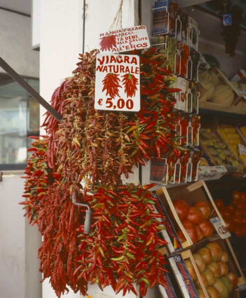 ITALY, Campania, Amalfi, "Via Genova, Main Street. Dried Chilli peppers hanging outside a shop.