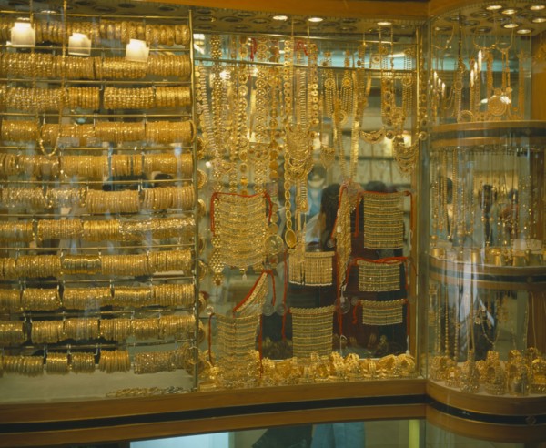 UAE, Dubai, Yellow Gold displayed in shop window. Different types of jewellery including necklaces