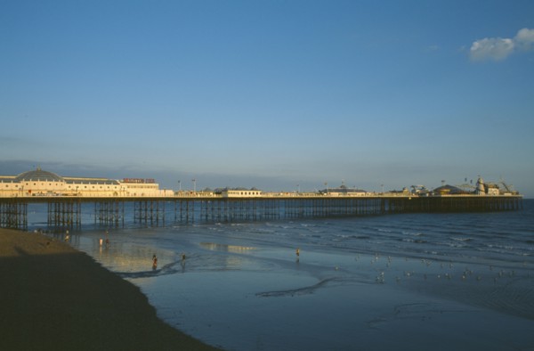 ENGLAND, East Sussex, Brighton, Brighton Pier in early evening light.