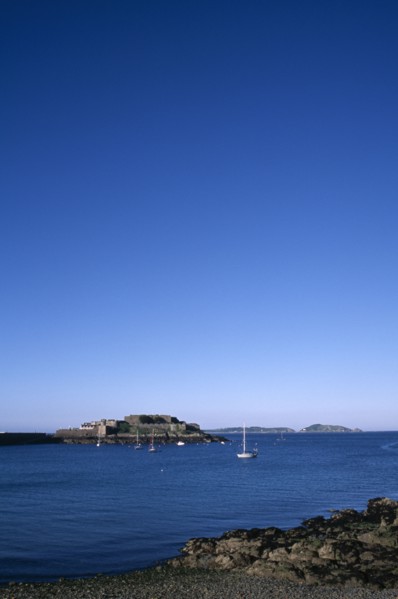 UNITED KINGDOM, Channel Islands, Guernsey, St Peter port. Castle Cornet seen from across water.
