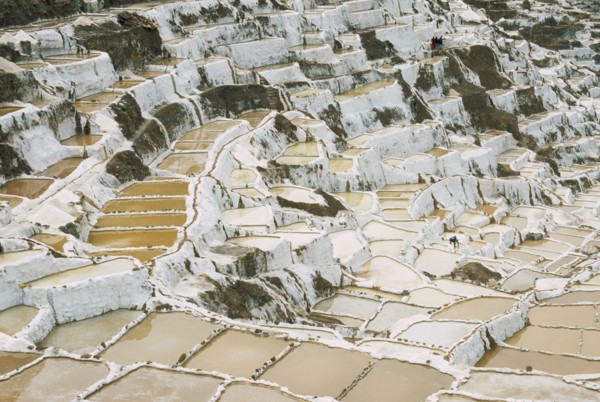 PERU, Cusco, Salineras, People working on the Salt Mines dating back to Inca times. Near Urubamba.