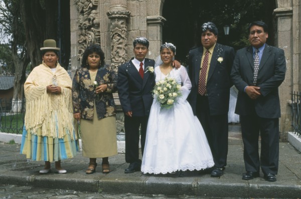 BOLIVIA, La Paz, "Wedding in El Monticulo. Bride, Groom and guests standing outside."