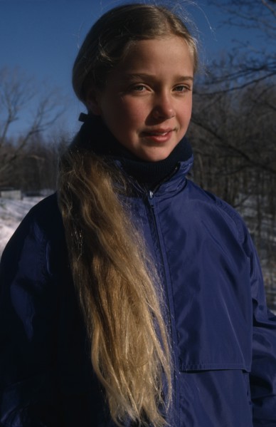 CHILDREN, Portraits, "Portrait of young girl with long blonde hair outdoors, dressed for cold