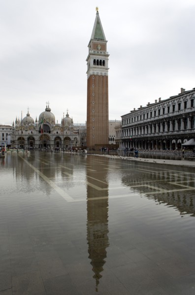 ITALY, Veneto, Venice, Aqua Alta High Water flooding in St Marks Square with St marks Basilica and