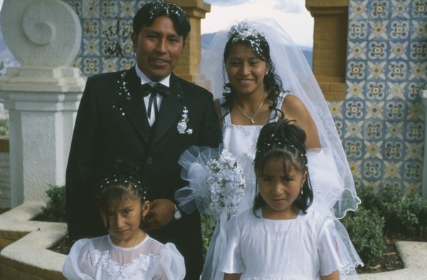 BOLIVIA, La Paz, "Wedding in El Monticulo. Bride, Groom and two young bridesmaids."