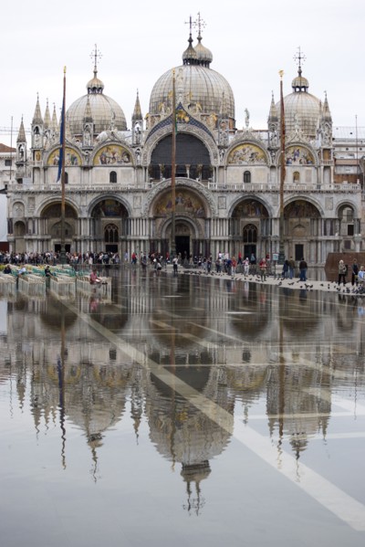 ITALY, Veneto, Venice, Aqua Alta High Water flooding in St Marks Square showing St Marks Basilica