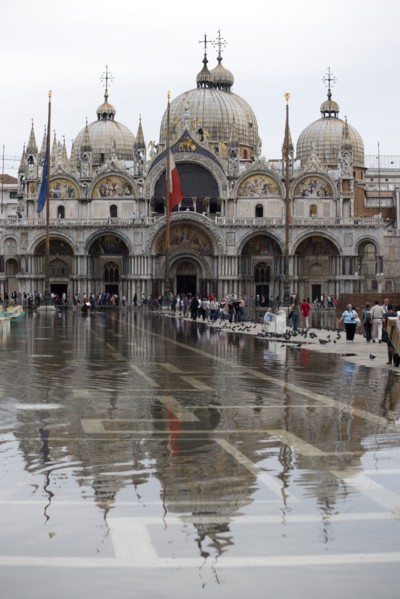ITALY, Veneto, Venice, Aqua Alta High Water flooding in St Marks Square showing St Marks Basilica