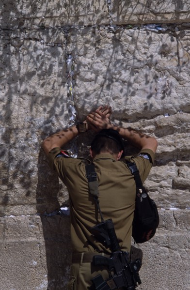 ISRAEL, Jerusalem, An Israeli Soldier in army uniform with a M16 Assault Riffle around his shoulder