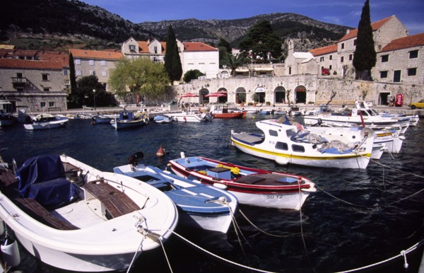 CROATIA, Dalmatia, Brac, "Bol marina nestled beneath Vidova Gora mountain ridge on the south side