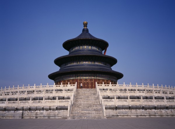 CHINA, Beijing, Temple of Heaven.  Hall of Prayer for Good Harvests with western tourist standing