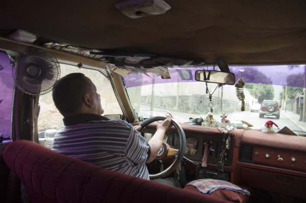 VENEZUELA, Caracas , Passenger seat view of a Caracas taxi including ventilation fan and dash-board