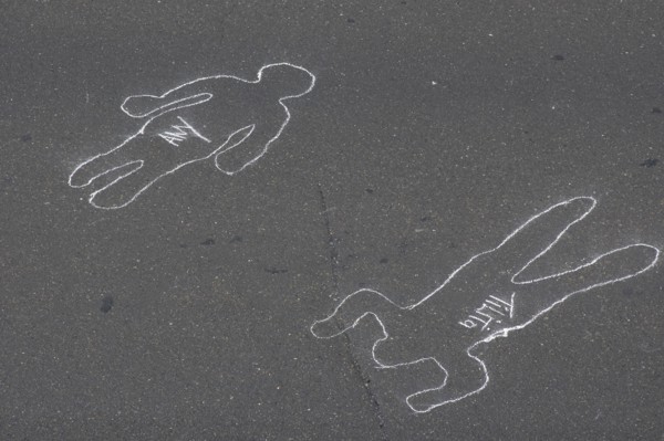 VENEZUELA, Caracas, Chalk outlines with the names of participants in an event on Avenida Francisco