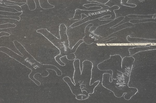 VENEZUELA, Caracas, Chalk outlines with the names of participants in an event on Avenida Francisco