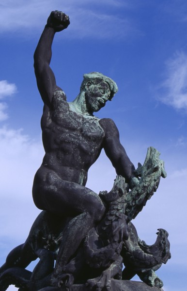 HUNGARY, Budapest, Gellert Hill.  Detail of statue of male figure slaying a multi headed serpant.